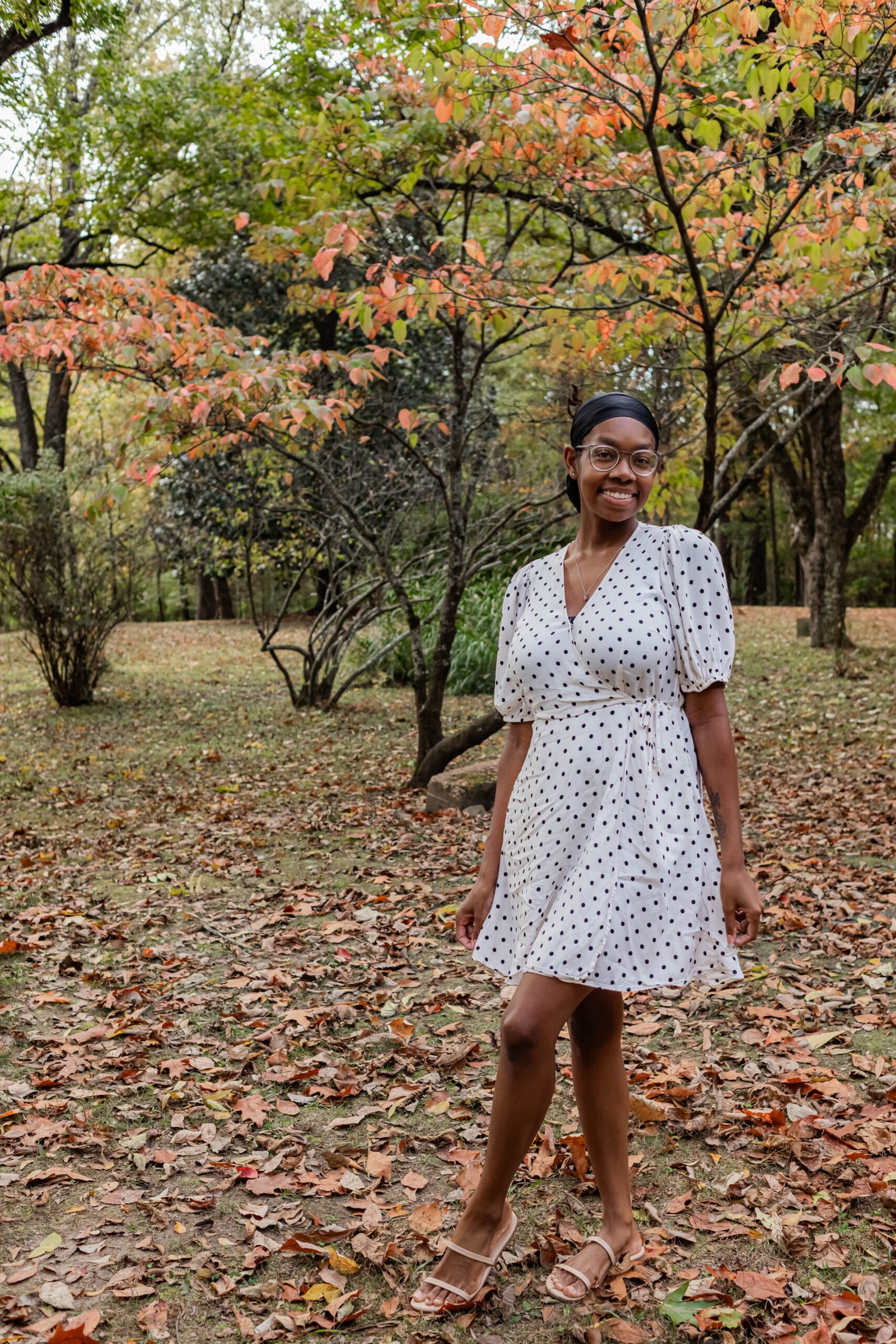 Image of Lisa smiling outside during the fall